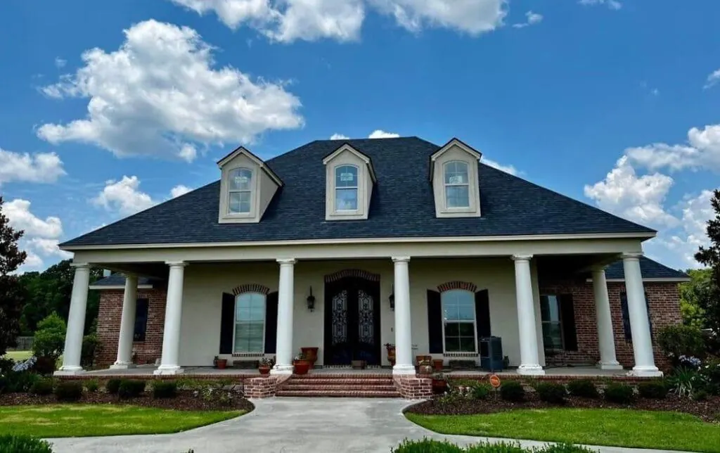 Southern columned home with new dark architectural asphalt shingle roof