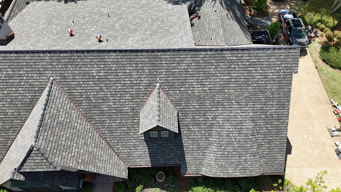 Aerial view of a designer architectural shingle field on a large residence