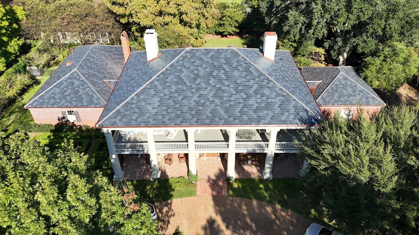 Stately columned home with new synthetic slate roof and copper flashing details