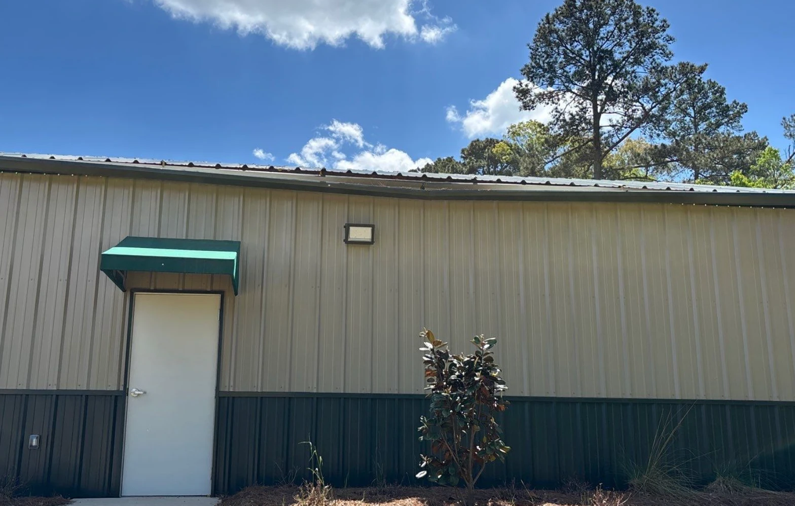 Metal commercial building with a built-in box gutter drainage system in North Louisiana