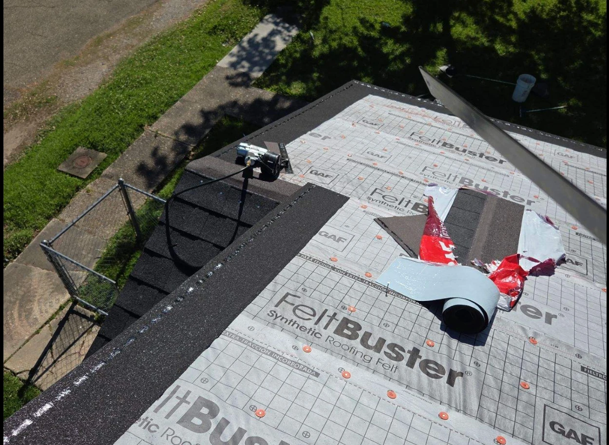 Synthetic roofing underlayment installed over the roof deck during a Louisiana roof replacement
