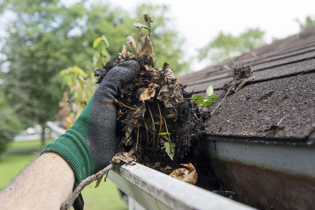Gutter cleaning clogged gutters.